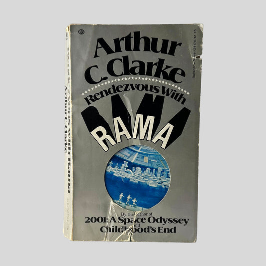 Front cover view of Rendezvous With Rama by Arthur C. Clarke centered on a neutral light gray background. Significant chipping to bottom center and top right edge. Additional chipping is present at the oop front of the spine corner.