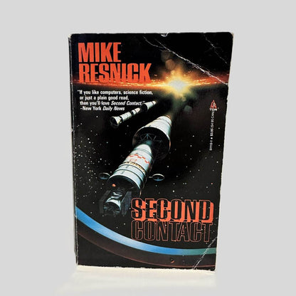 Front cover view of Second Contact by Mike Resnick centered on a neutral light gray background. Creasing on the top and bottom right corners.