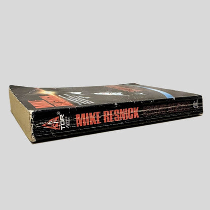 Close-up spine view of Second Contact by Mike Resnick centered on a neutral light gray background. Spine shows creasing and chipping at the top of spine. Pages lay flat.