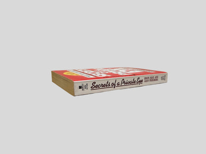 Close-up spine view of Secrets of a Private Eye by Irwin Blye & Ardy Friedberg centered on a neutral light gray background. Spine shows minimal creasing.