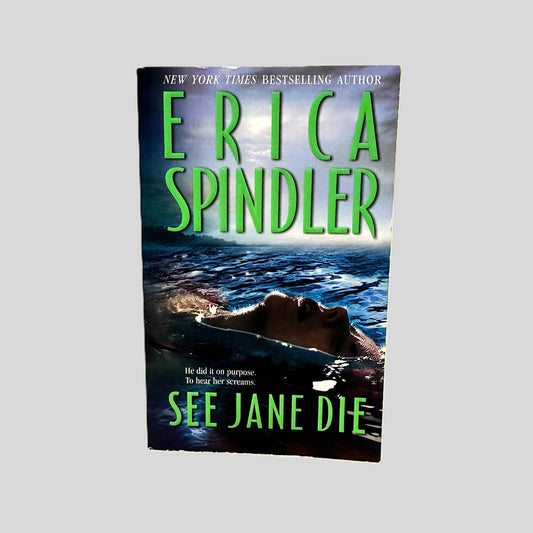 Front cover view of See Jane Die by Erica Spindler centered on a neutral light gray background. Minimal chipping to the top edge of the cover.