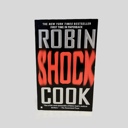 Front cover view of Shock by Robin Cook centered on a neutral light gray background. 
