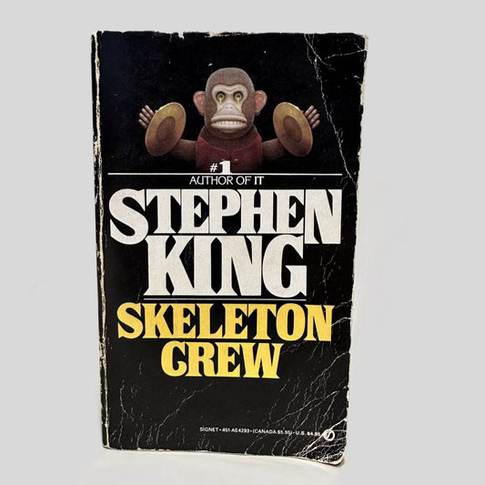 Front cover view of Skeleton Crew by Stephen King centered on a neutral light gray background. Creasing, chipping, rubbing present.