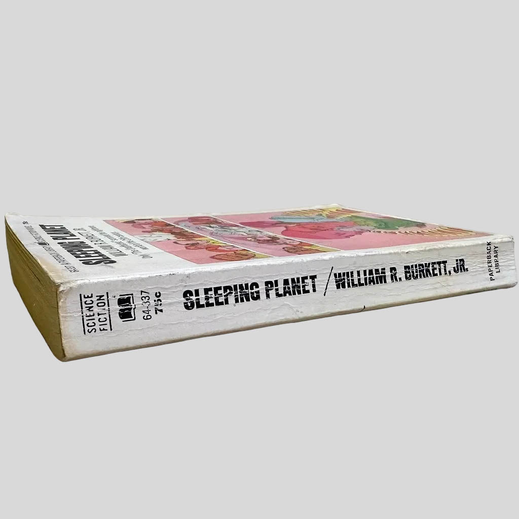 Close-up spine view of Sleeping Planet by William R. Burkett, Jr. centered on a neutral light gray background. Spine shows creasing. Pages lay flat.