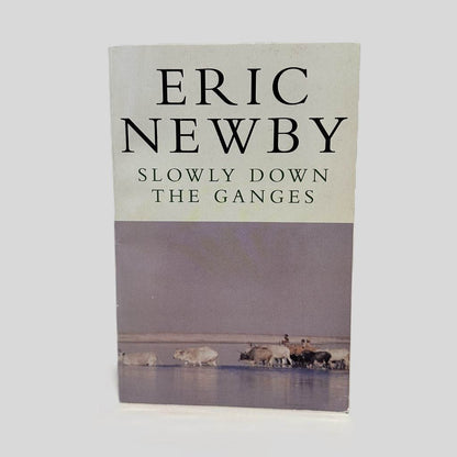 Front cover view of Slowly Down the Ganges by Eric Newby centered on a neutral light gray background. Minor chipping at the top and bottom corners.