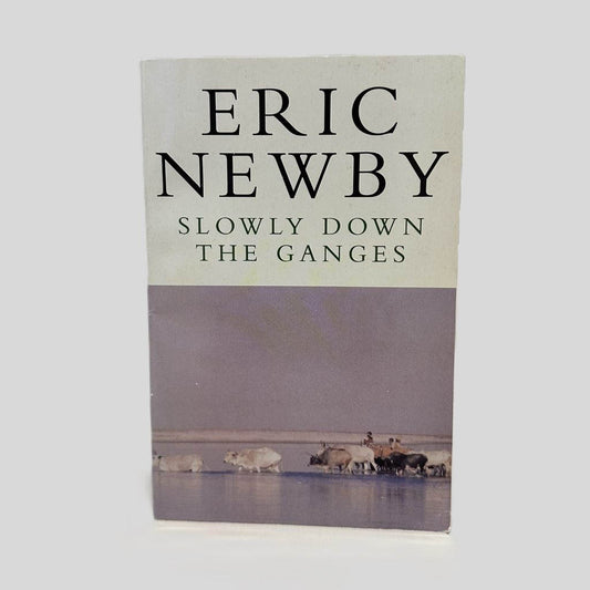 Front cover view of Slowly Down the Ganges by Eric Newby centered on a neutral light gray background. Minor chipping at the top and bottom corners.