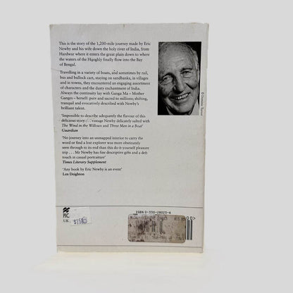 Back cover view of Slowly Down the Ganges by Eric Newby centered on a neutral light gray background. Chipping is present along the top edge.