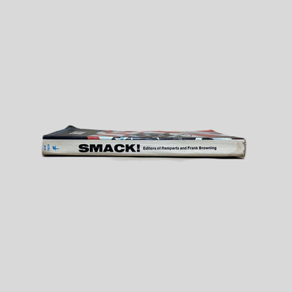 Close-up spine view of Smack by Frank Browning centered on a neutral light gray background. Spine shows minimal creasing and is square. Some light bumping.