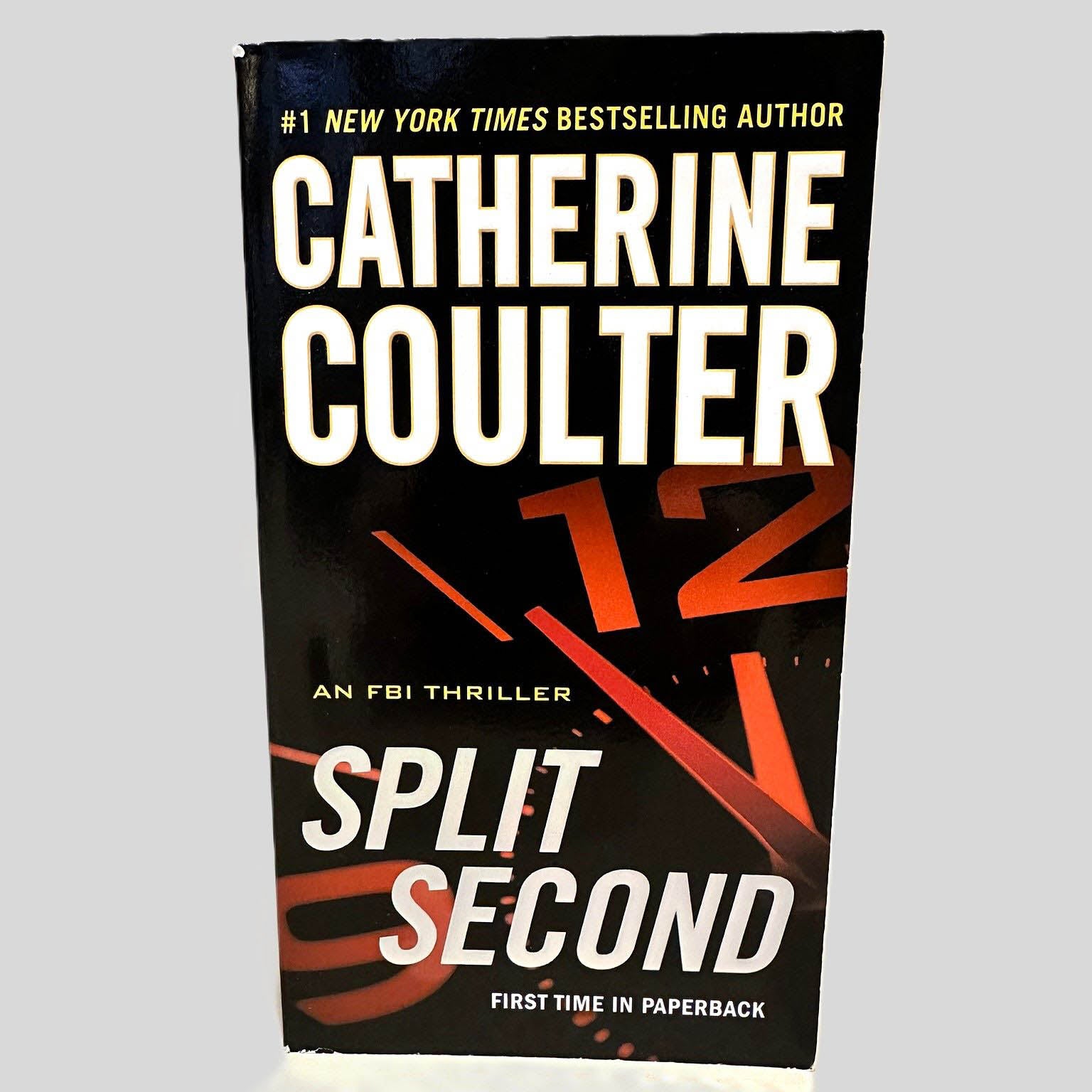 Front cover view of Split Second by Catherine Coulter centered on a neutral light gray background. 