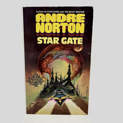 Front cover view of Star Gate by Andre Norton centered on a neutral light gray background. Chipping from normal wear and age around the edges. Cover art is vibrant.