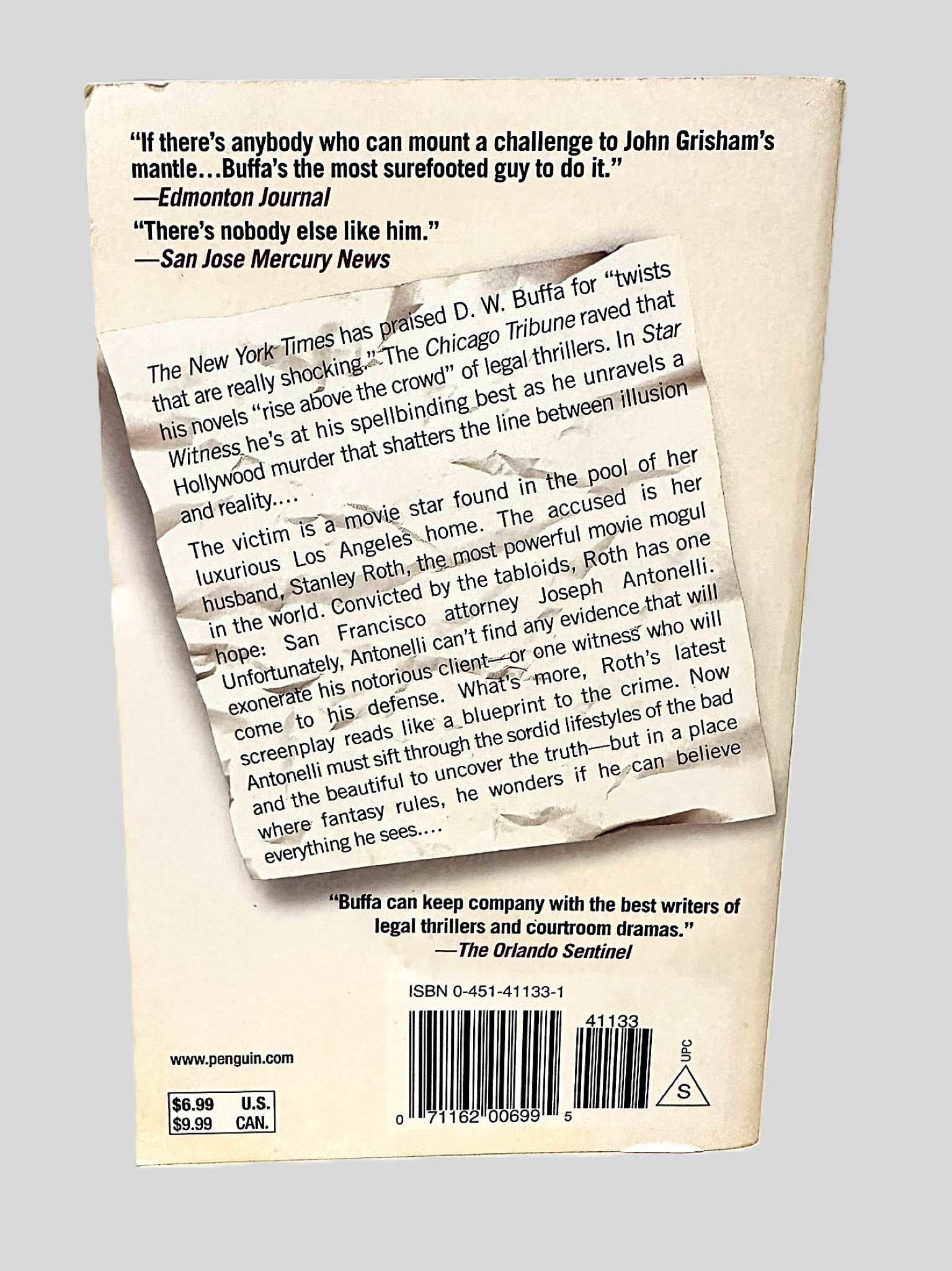 Back cover view of Star Witness by D.W. Buffa centered on a neutral light gray background. Minimal chipping on top left corner.