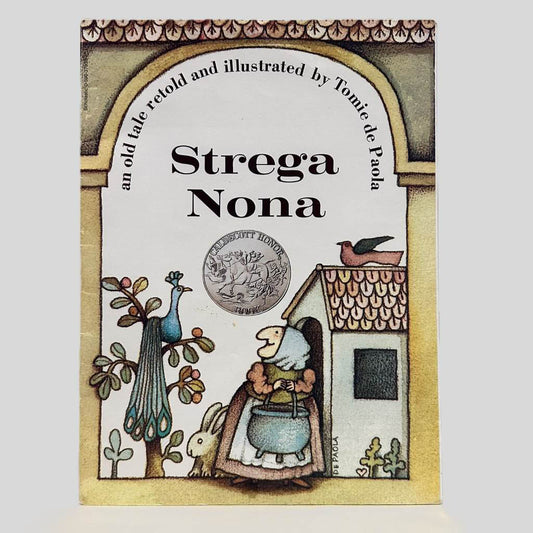 Front cover view of Strega Nona by Tomie de Paola centered on a neutral light gray background. Creasing near the spine is present.