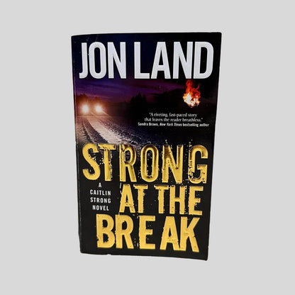 Front cover view of Strong at the Break by Jon Land centered on a neutral light gray background. 