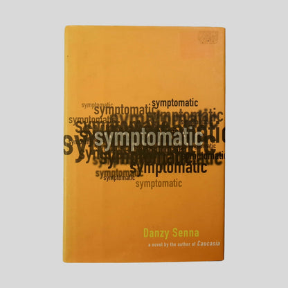 Front cover view of Symptomatic by Danzy Senna centered on a neutral light gray background. Dust jacket is present and aside from remnants of a small rectangle shaped sticker in the top right corner, there is no damage to the dust jacket.