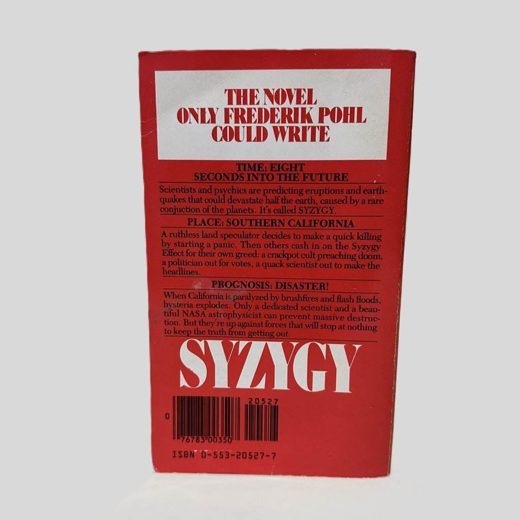 Back cover view of Syzygy by Frederik Pohl centered on a neutral light gray background. Minor chipping around the edges from normal wear.