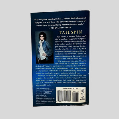 Back cover view of Tailspin by Sandra Brown centered on a neutral light gray background. 