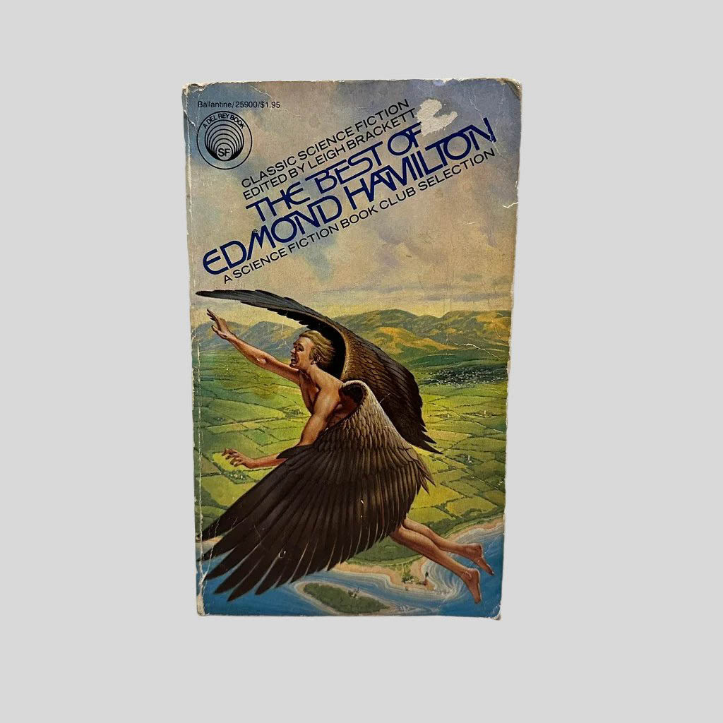 Front cover view of The Best of Edmond Hamilton edited by Leigh Brackett centered on a neutral light gray background. Chipping and creasing on the front cover. Chip on the cover art near the book title. Cover art is other wise vibrant.