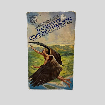 Front cover view of The Best of Edmond Hamilton edited by Leigh Brackett centered on a neutral light gray background. Chipping and creasing on the front cover. Chip on the cover art near the book title. Cover art is other wise vibrant.