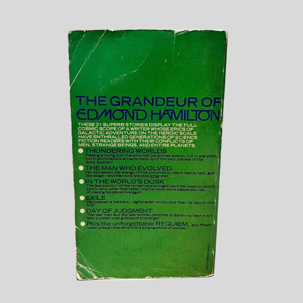 Back cover view of The Best of Edmond Hamilton edited by Leigh Brackett centered on a neutral light gray background. Significant chipping and creasing around the edges of the back cover. Text summary on the cover is completely intact and vibrant.