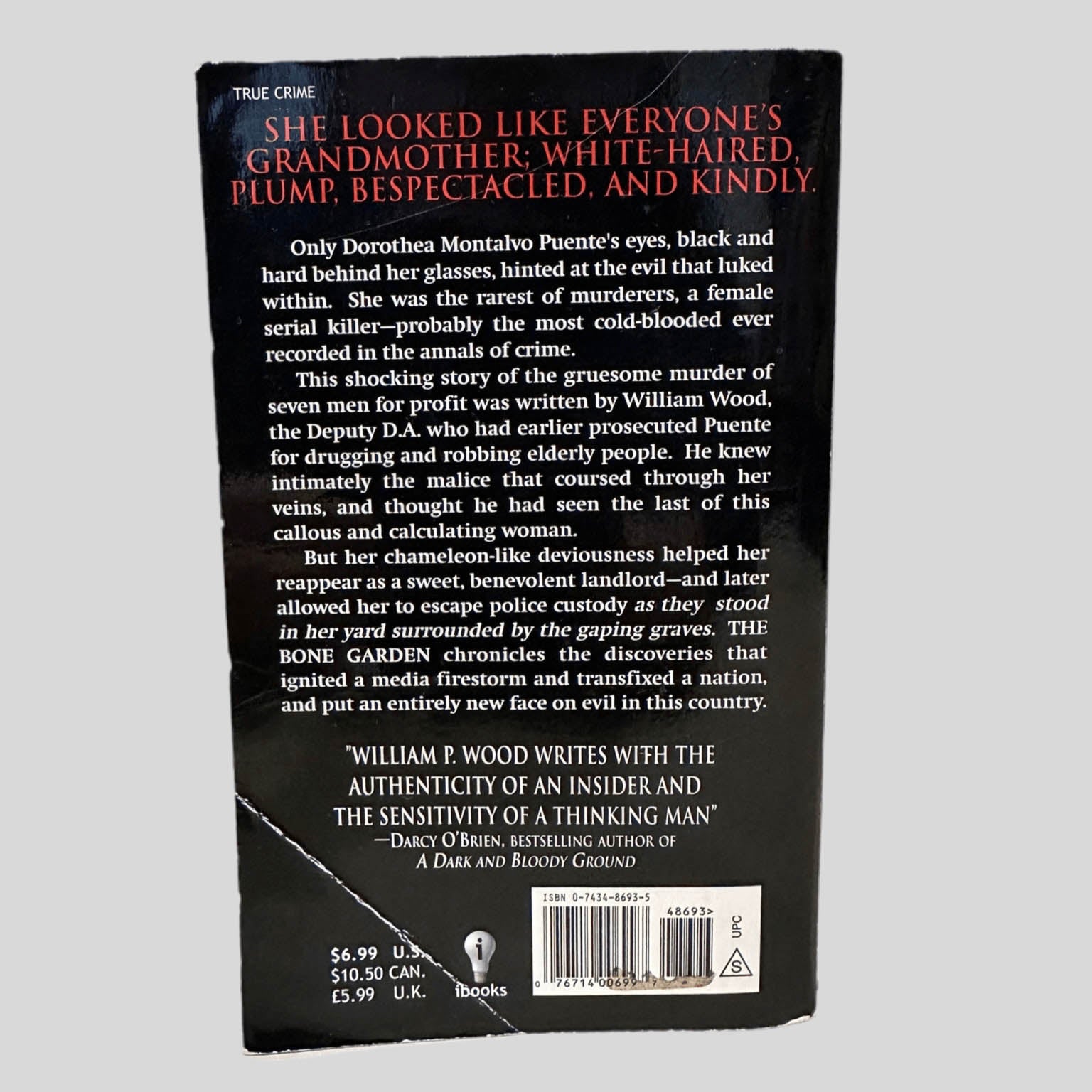 Back cover view of The Bone Garden by William P. Wood centered on a neutral light gray background. 