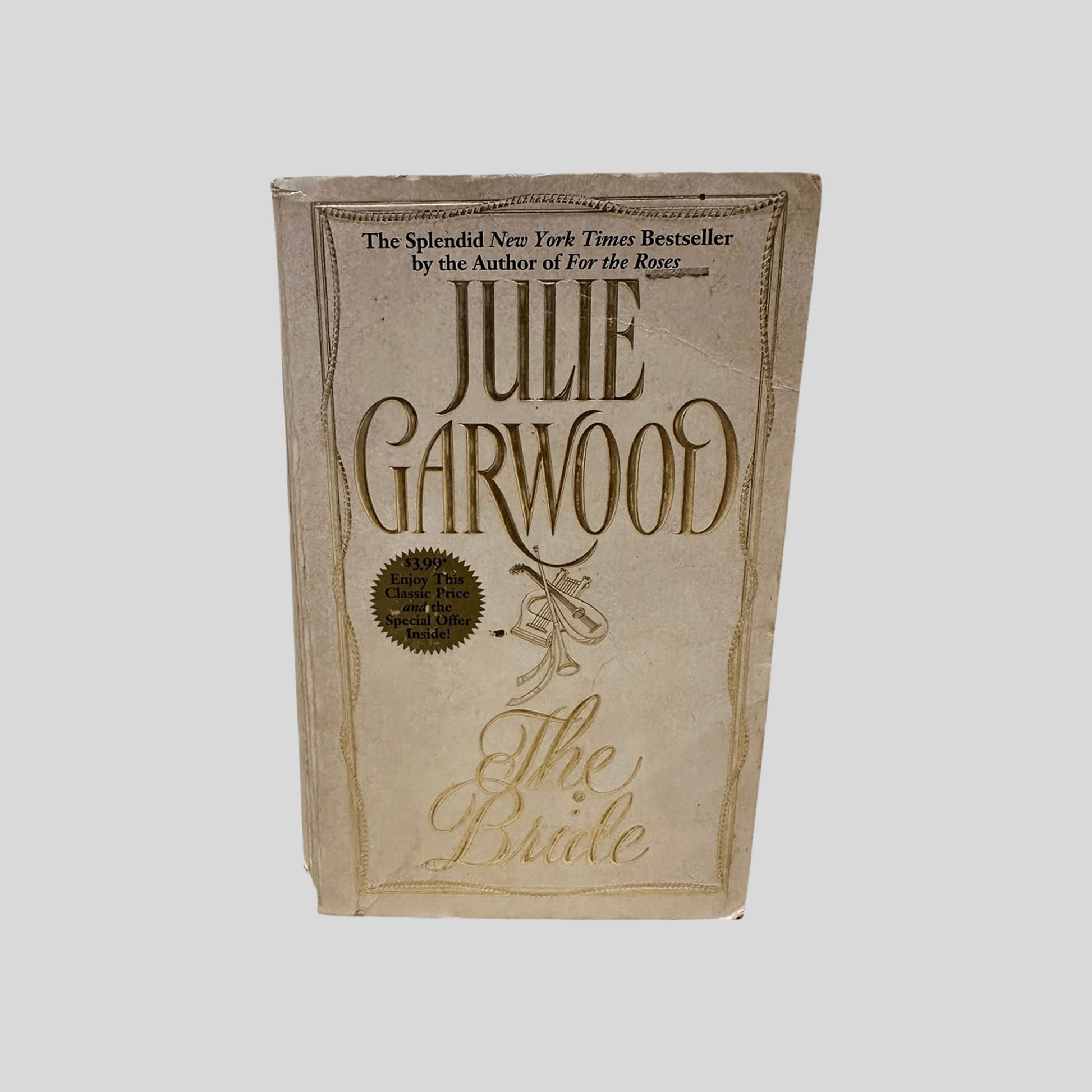 Front cover view of The Bride by Julie Garwood centered on a neutral light gray background. 