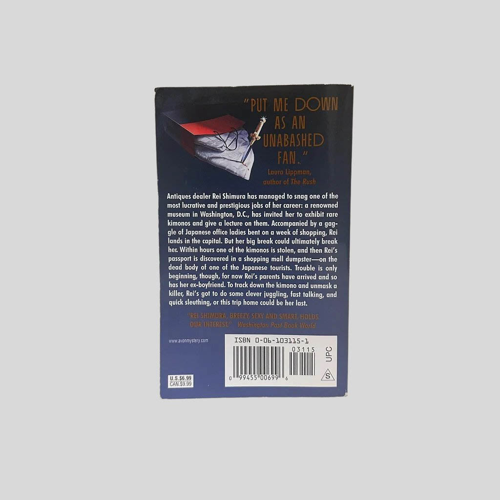 Back cover view of The Bride's Kimono by Sujata Massey centered on a neutral light gray background. 