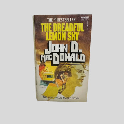 Front cover view of The Dreadful Lemon Sky by John D. MacDonald centered on a neutral light gray background. 