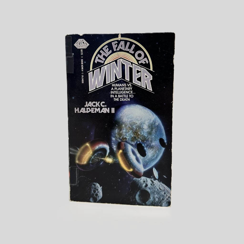 Front cover view of The Fall of Winter by Jack C. Haldeman II centered on a neutral light gray background.  Chipping is present around the edges from age and wear as a library edition.