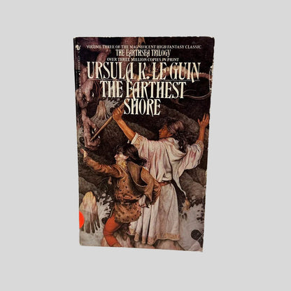Front cover view of The Farthest Shore by Ursula K. Le Guin centered on a neutral light gray background. Normal chipping around the edges from age. Creasing to the bottom right corner. Cover art is vibrant.