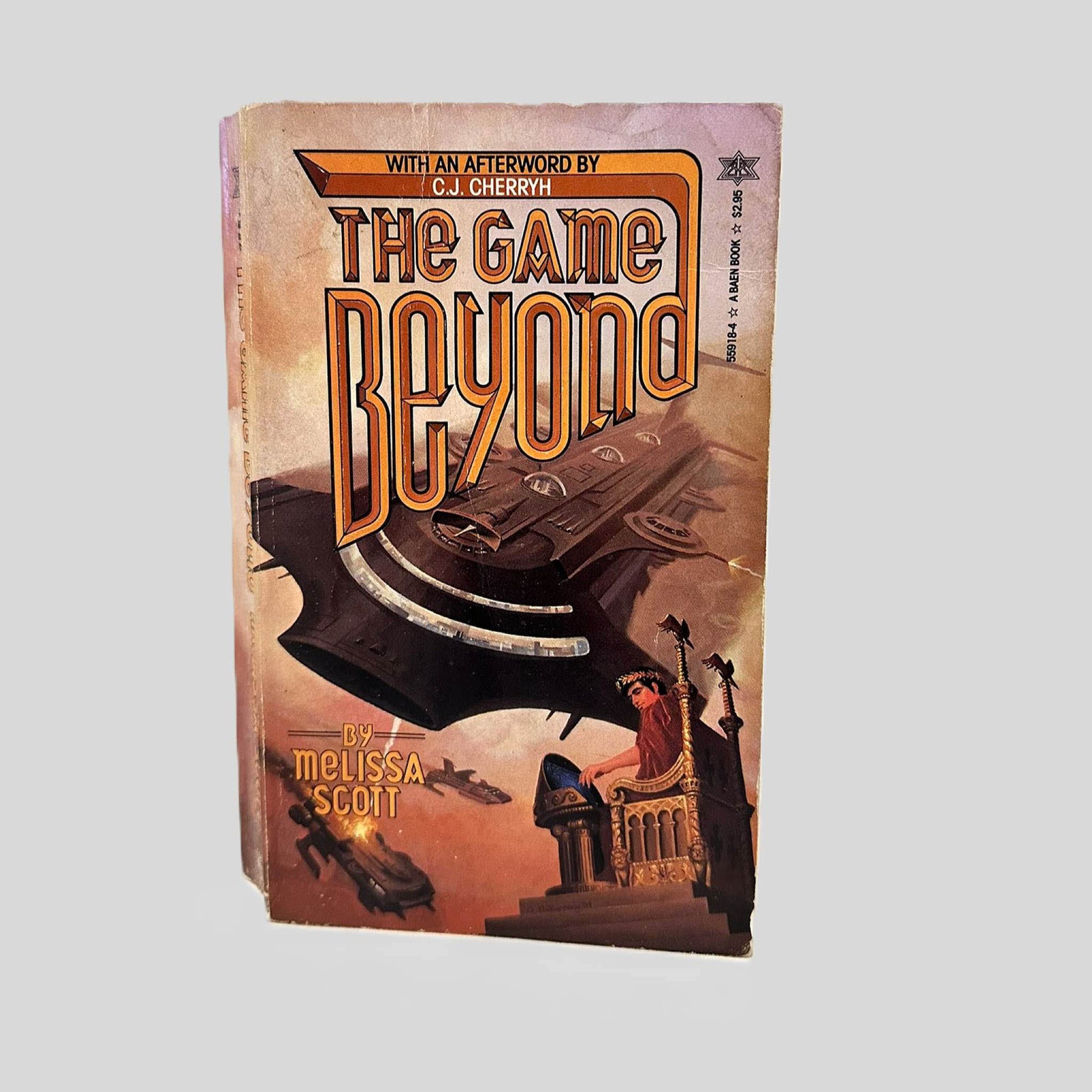 Front cover view of The Game Beyond by Melissa Scott centered on a neutral light gray background. Top edge of cover shows chipping. Normal wear for age.