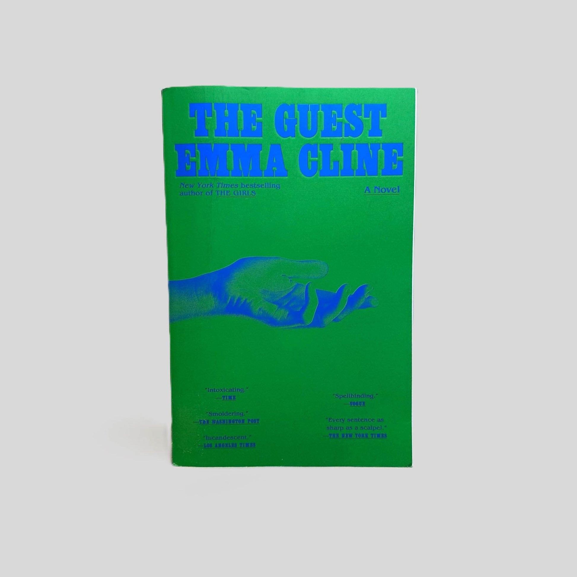 Front cover view of The Guest by Emma Cline centered on a neutral light gray background. 