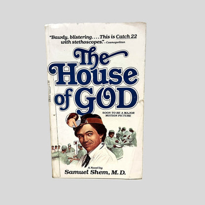 Front cover view of The House of God by Samuel Shem, M.D. centered on a neutral light gray background. Chipping and creasing are present. Transparent tape on the spine edge.