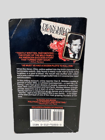 Back cover view of The Hunting of Cain by Dan E. Moldea centered on a neutral light gray background. 