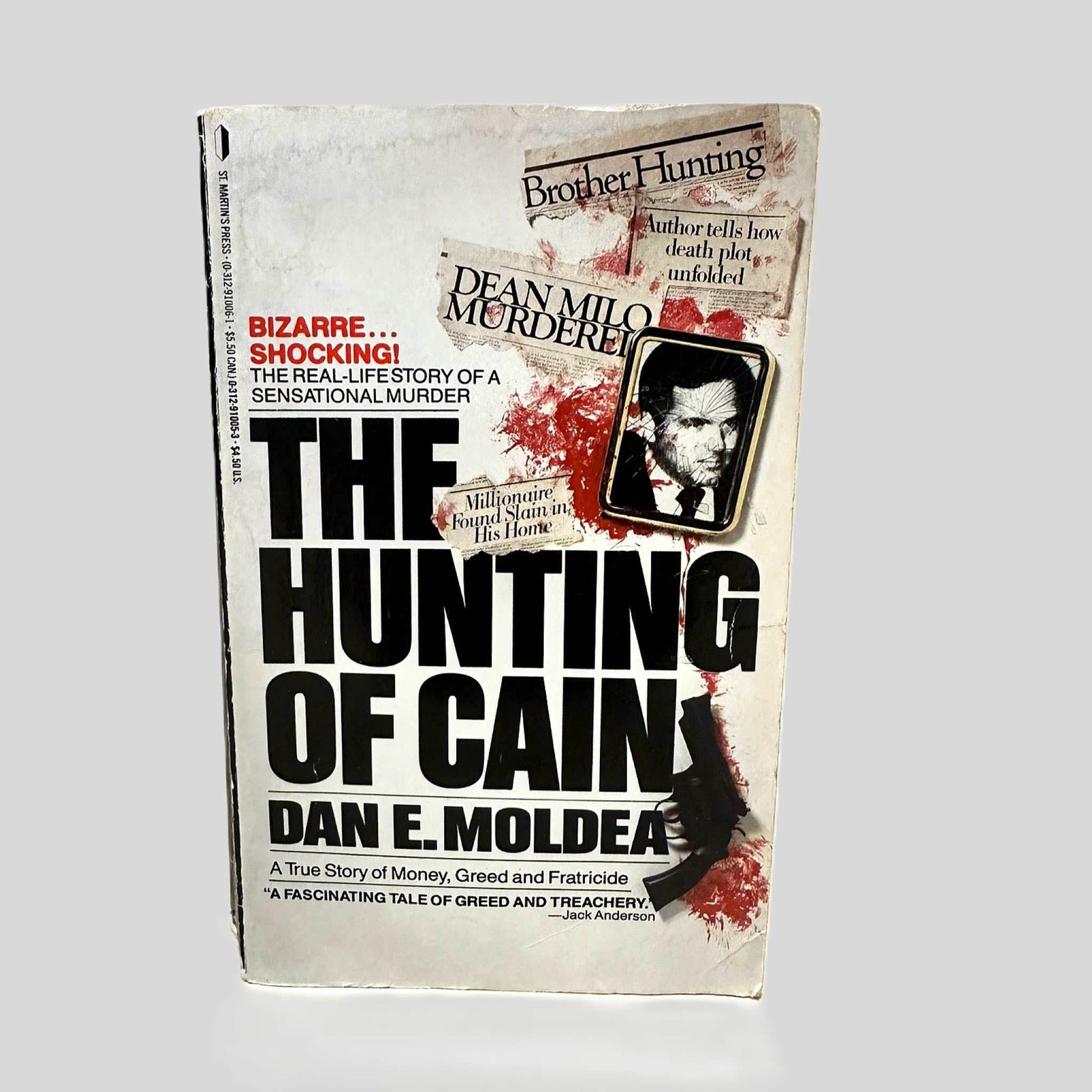 Front cover view of The Hunting of Cain by Dan E. Moldea centered on a neutral light gray background. 