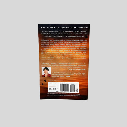 Back cover view of The Invention of Wings by Sue Monk Kidd centered on a neutral light gray background. 