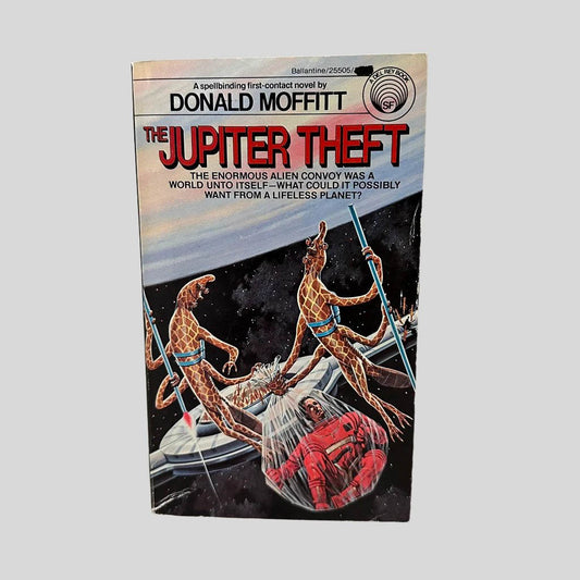 Front cover view of The Jupiter Theft by Donald Moffitt centered on a neutral light gray background. Minor chipping from normal wear and age. Cover art is vibrant.