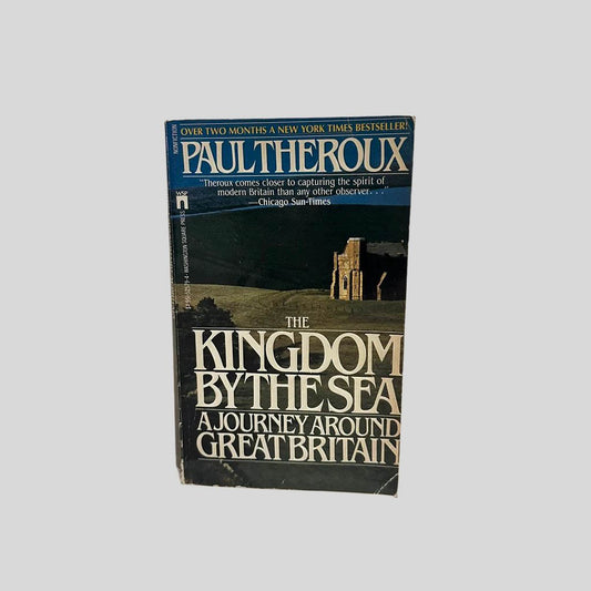 Front cover view of The Kingdom by the Sea by Paul Theroux centered on a neutral light gray background. Minor creasing to the corners. Creasing is visible near the spine.