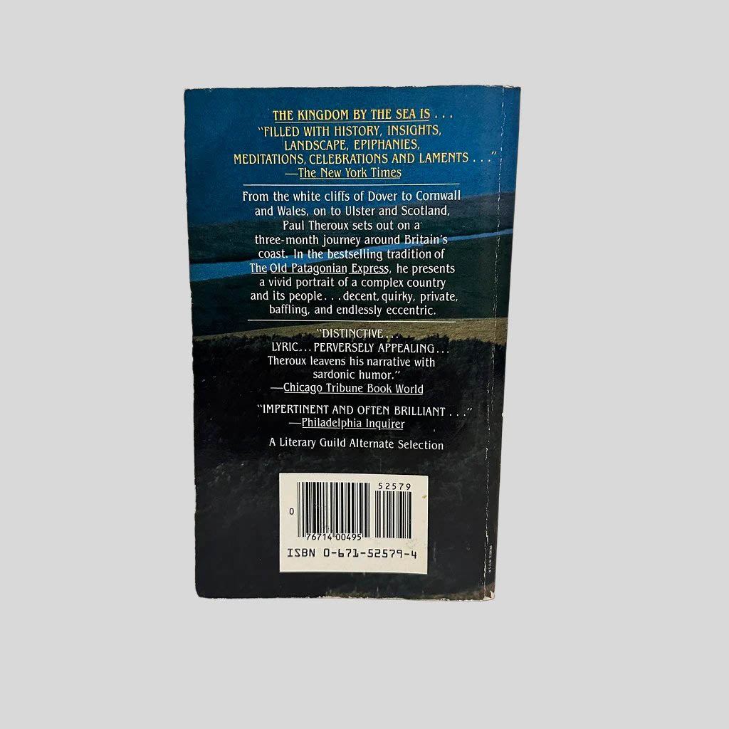Back cover view of The Kingdom by the Sea by Paul Theroux centered on a neutral light gray background. Creasing is present near the spine edge. Chipping from normal wear around the edges.