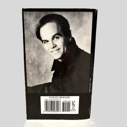 Back cover view of The Laws of Our Fathers by Scott Turow centered on a neutral light gray background. 