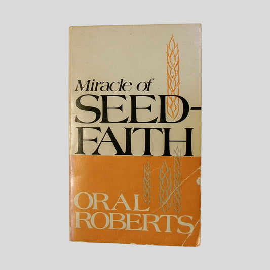 Front cover view of The Miracle Of Seed Faith by Oral Roberts centered on a neutral light gray background. Creasing and normal chipping in the bottom right corner. Cover art is vibrant.