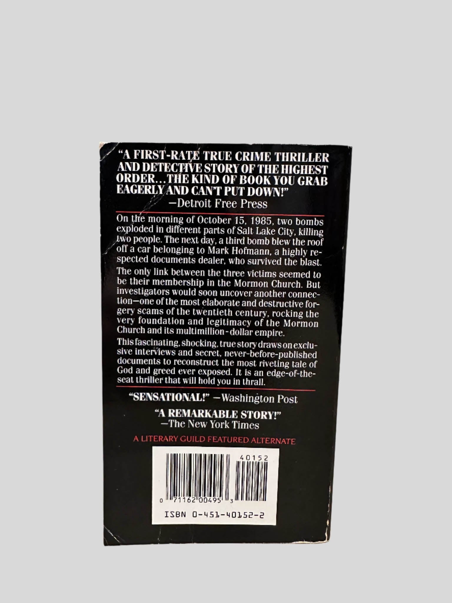 Back cover view of The Mormon Murders by Steven Naifeh & Gregory White Smith centered on a neutral light gray background. 