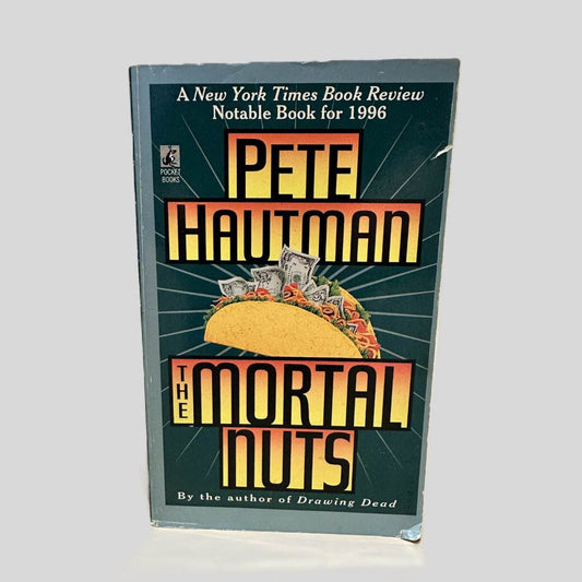 Front cover view of The Mortal Nuts by Pete Hautman centered on a neutral light gray background. Chipping on the bottom right corner and along the top edge.