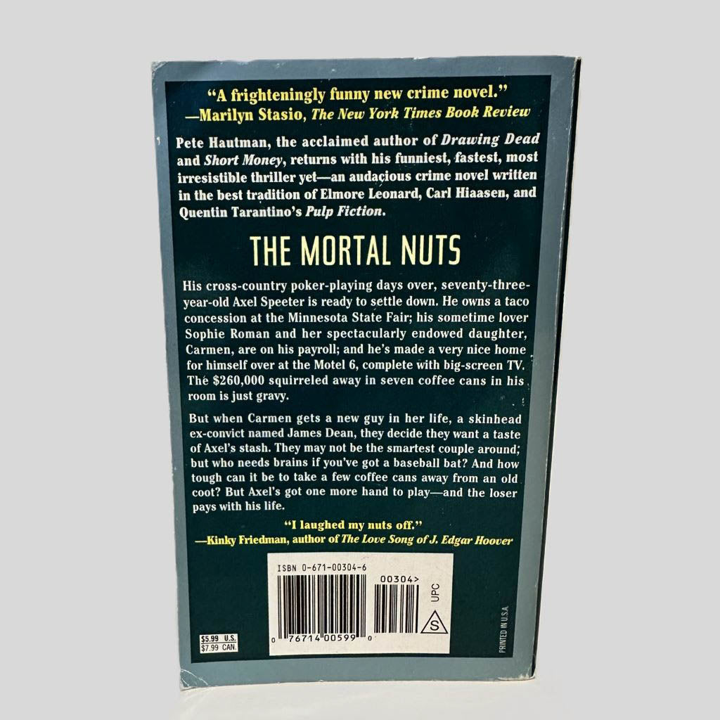 Back cover view of The Mortal Nuts by Pete Hautman centered on a neutral light gray background. Minor chipping around the cover edges.