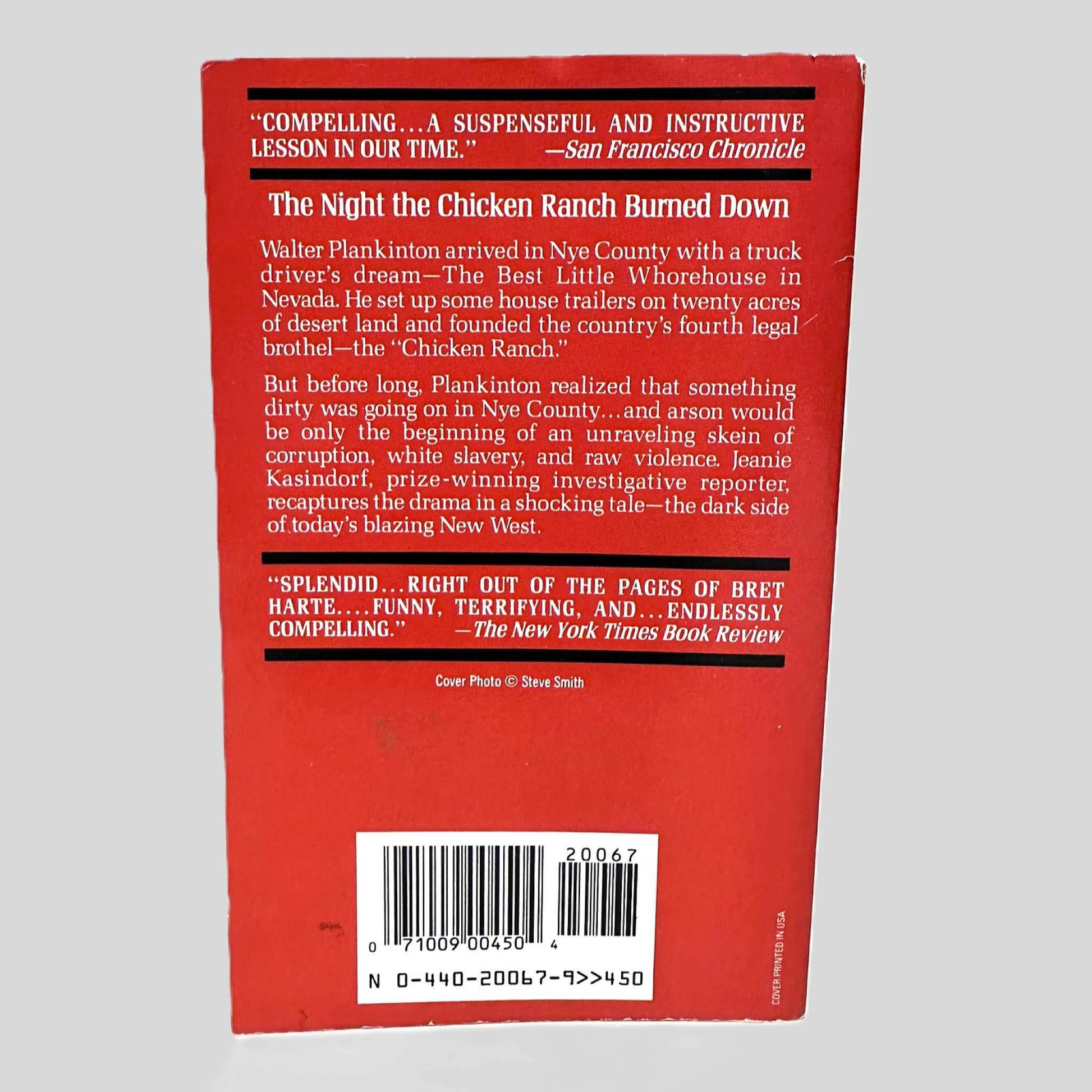 Back cover view of The NYE County Brothel Wars by Jeanie Kasindorf centered on a neutral light gray background. 