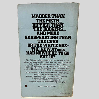 Back cover view of The New Atoms' Bombshell by Robert Browne centered on a neutral light gray background. Chipping and rubbing present.