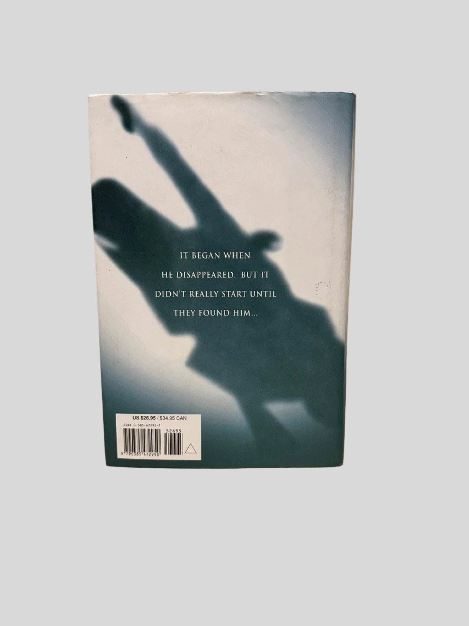 Back cover view of The Partner by John Grisham centered on a neutral light gray background. Dust jacket is present and shows no damage.
