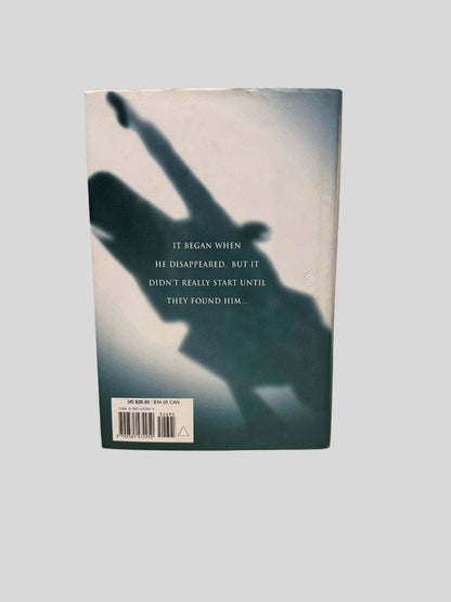 Back cover view of The Partner by John Grisham centered on a neutral light gray background. Dust jacket is present and shows no damage.