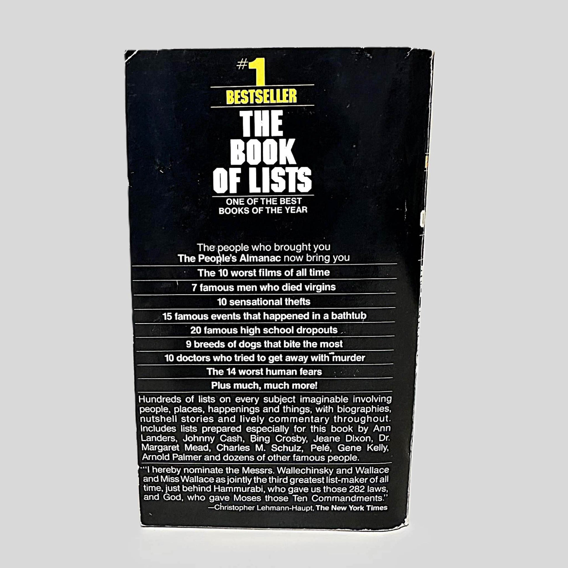 Back cover view of The People's Almanac Presents The Book of Lists centered on a neutral light gray background. Chipping present around the edges.