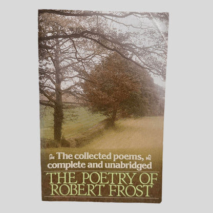 Front cover view of The Poetry of Robert Frost: The Collected Poems, Complete and Unabridged centered on a neutral light gray background. Crease in the top right corner.