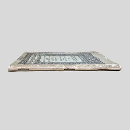 Close-up spine view of The Rape of the Lock by Alexander Pope centered on a neutral light gray background. 